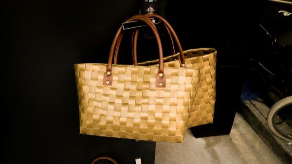 Woven yellow tote with leather handles